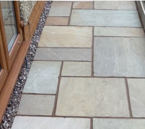 Detailed natural stone paving installation